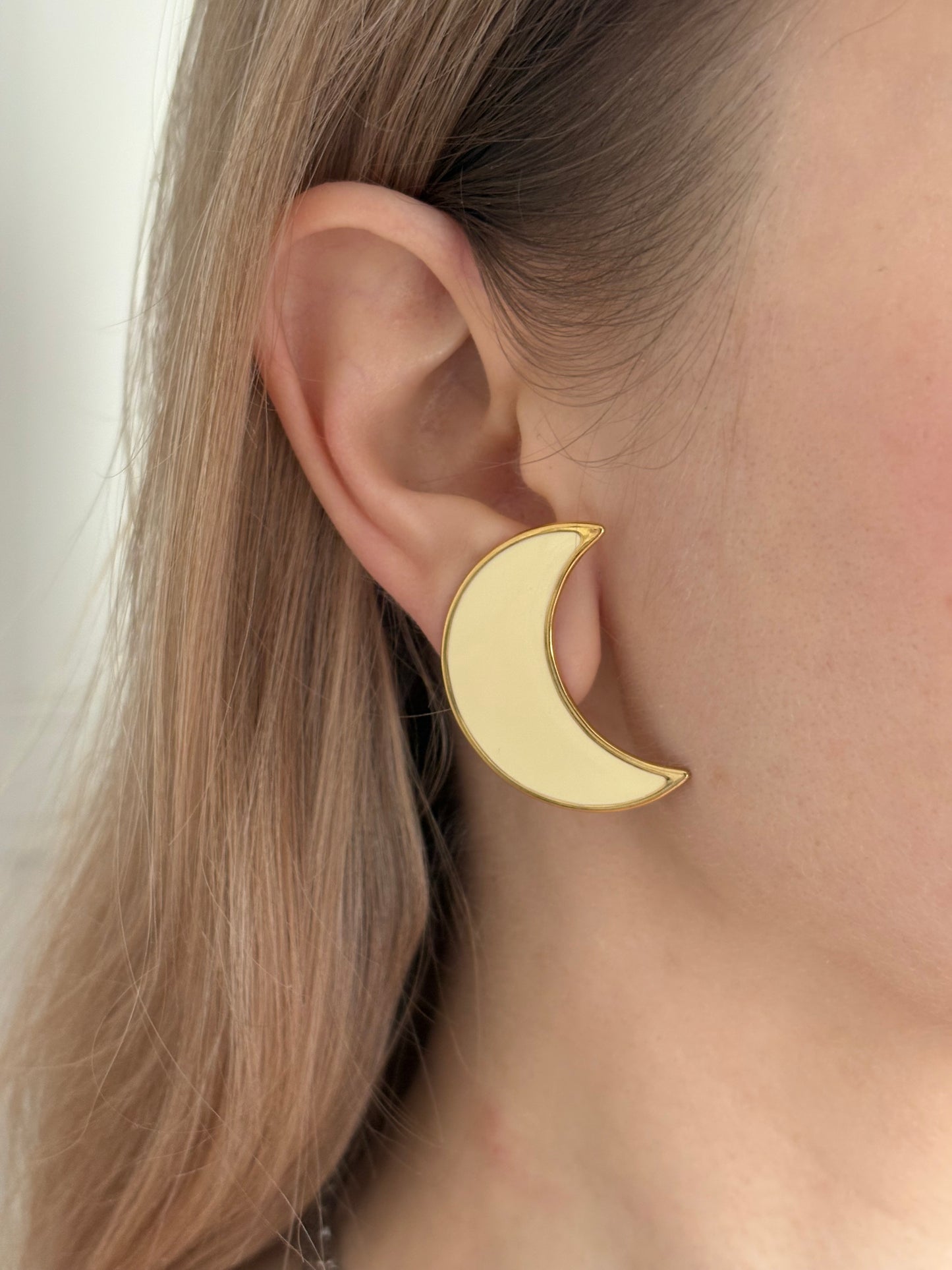 Clip-on earrings with milky enamel in the shape of a large moon