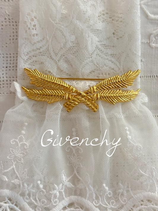 Pozłacana broszka Givenchy z motywem gałązek i kokardy