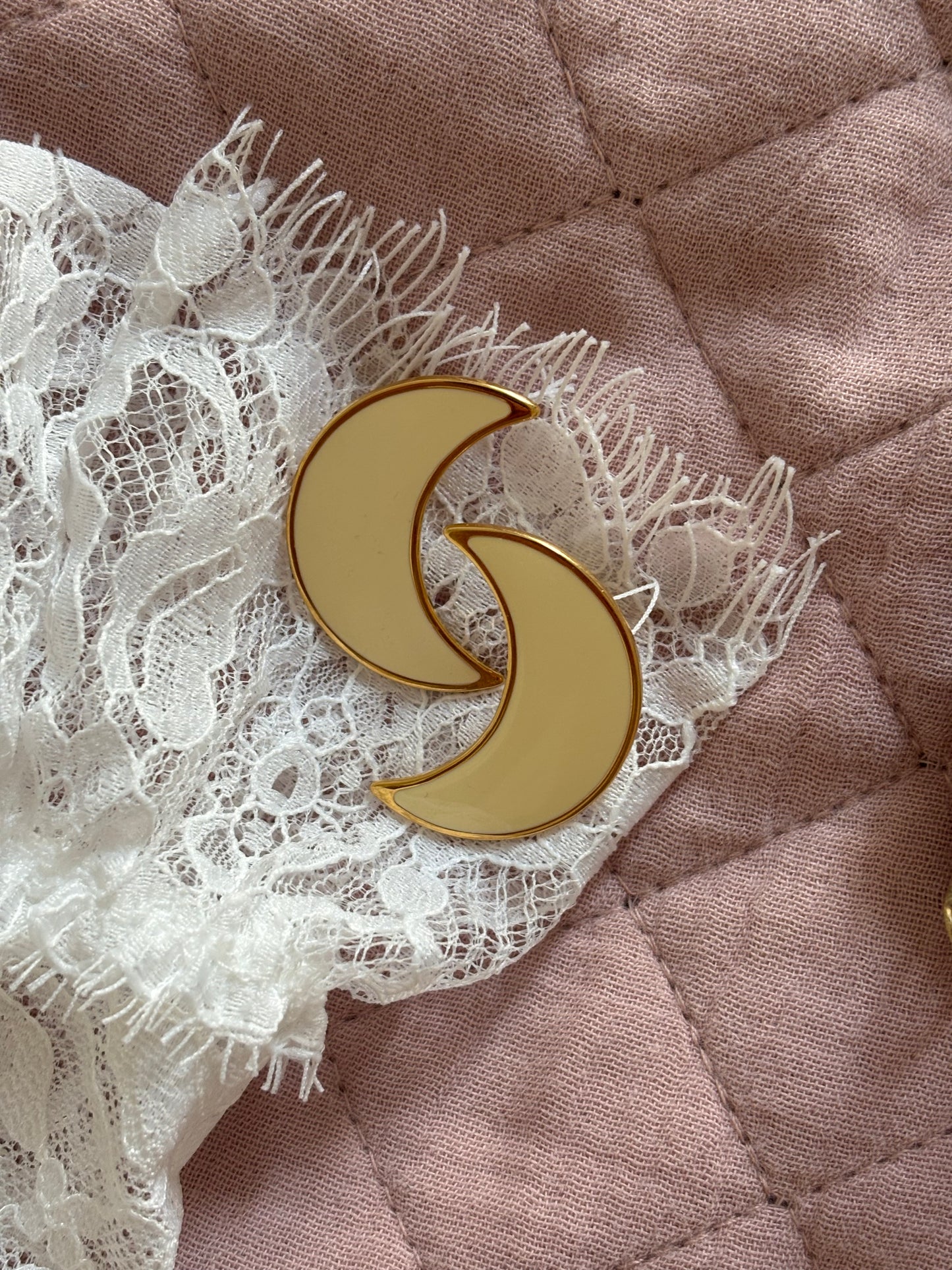 Clip-on earrings with milky enamel in the shape of a large moon