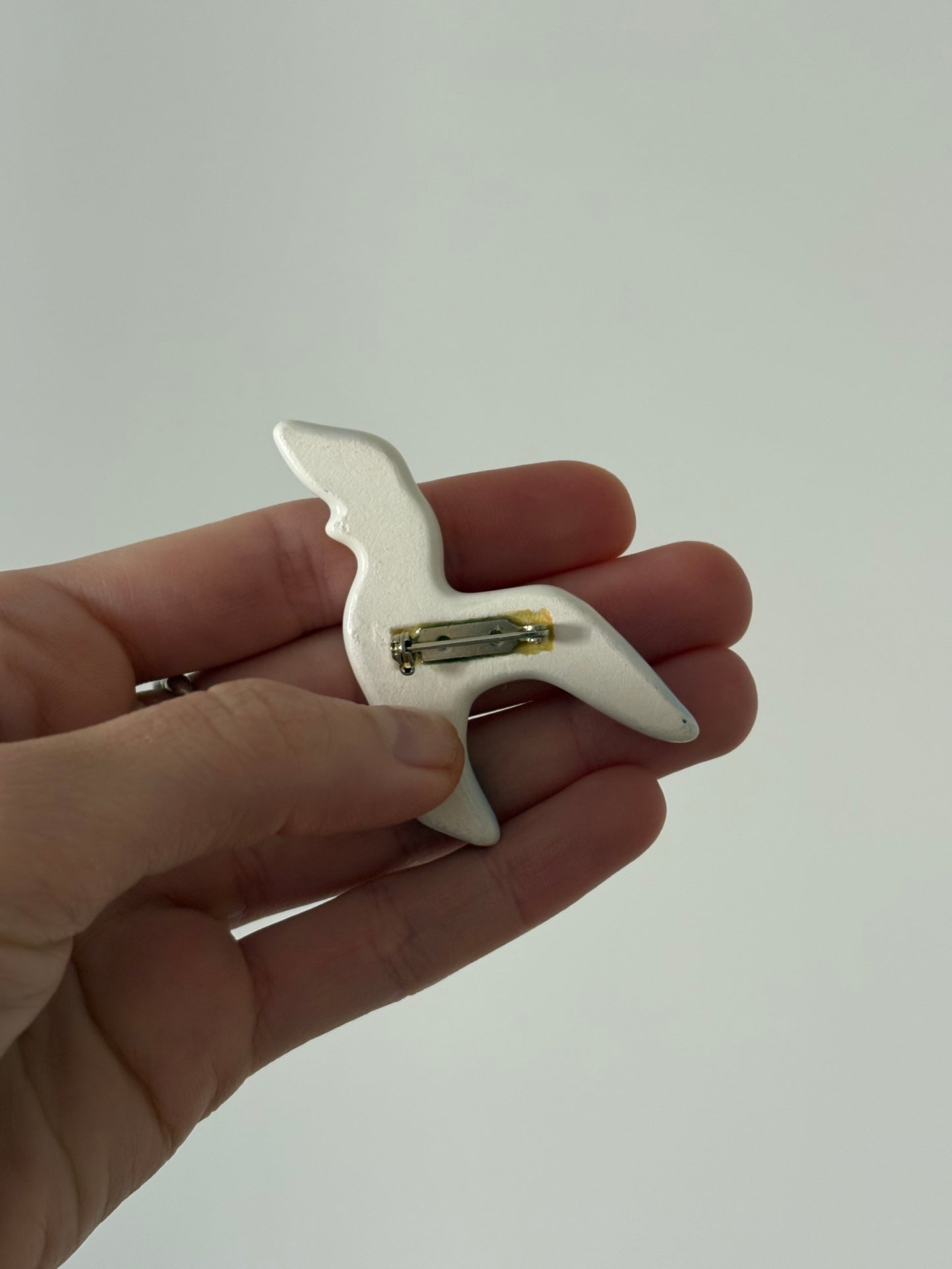 Avon "Take Flight" ceramic brooch, 1980