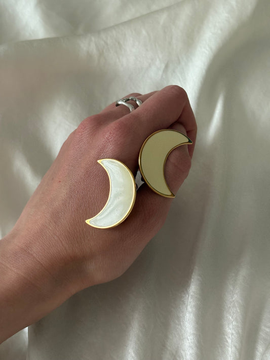 Clip-on earrings with milky enamel in the shape of a large moon