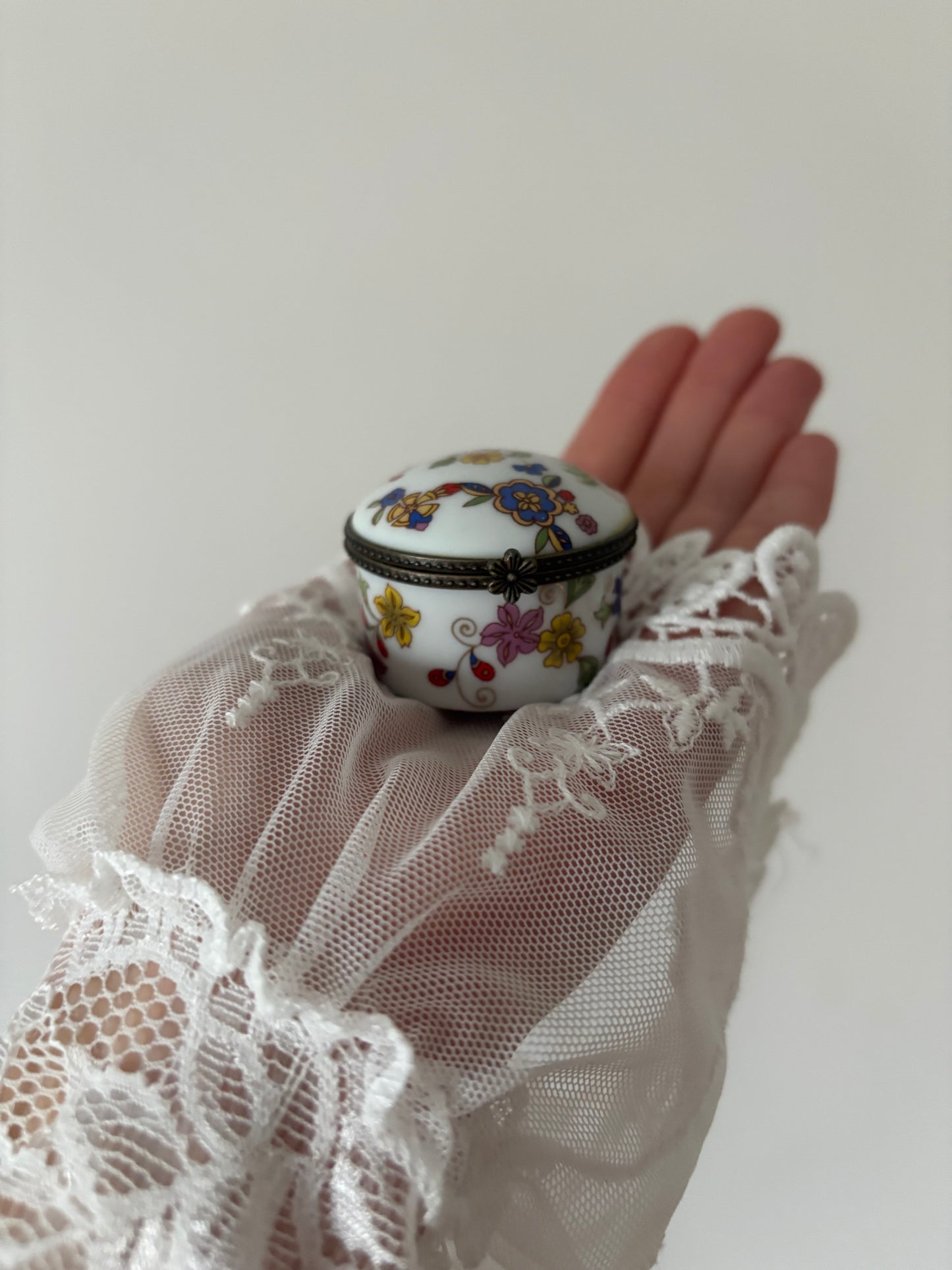 Round porcelain casket with colorful flowers