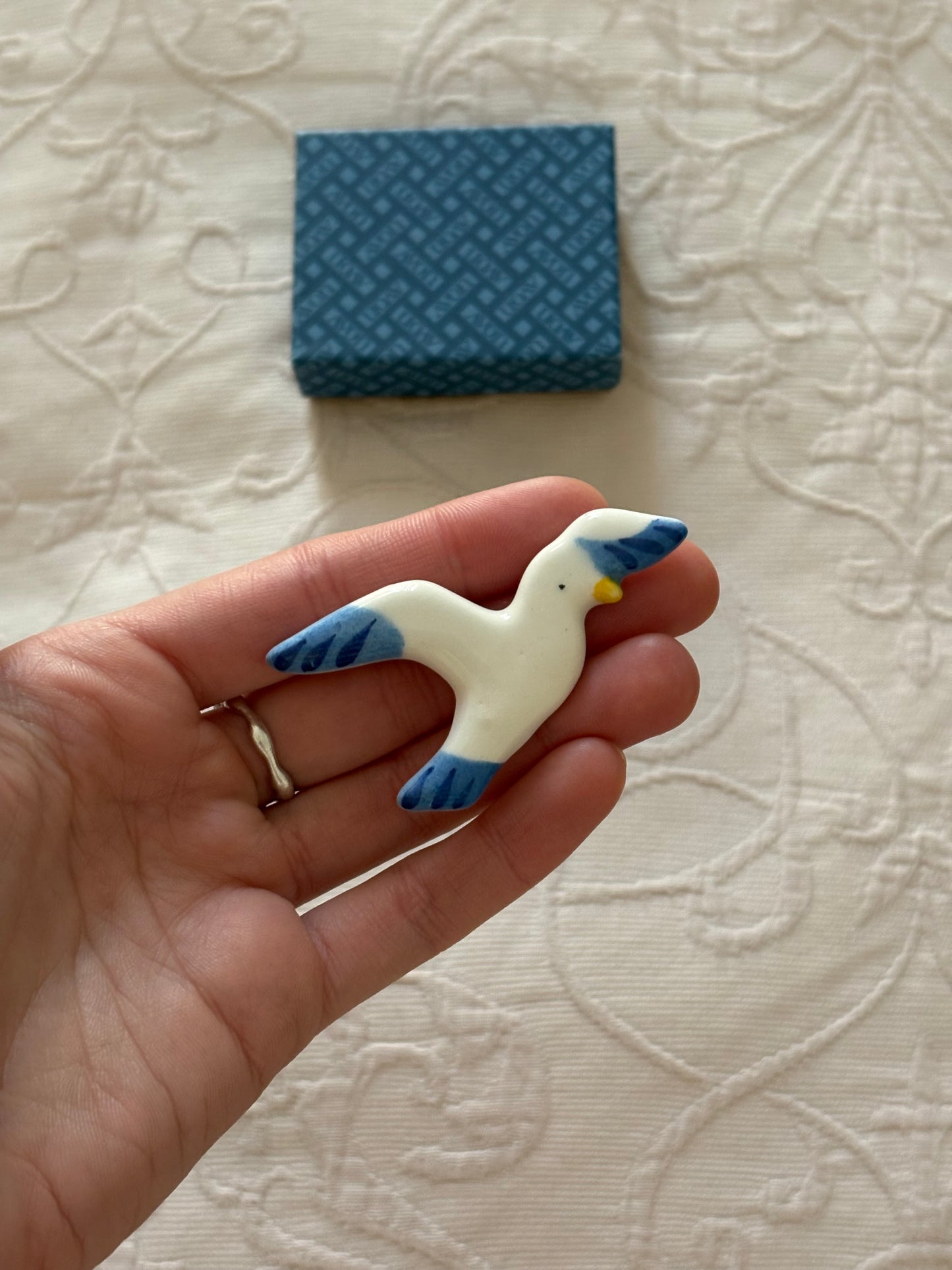 Avon "Take Flight" ceramic brooch, 1980