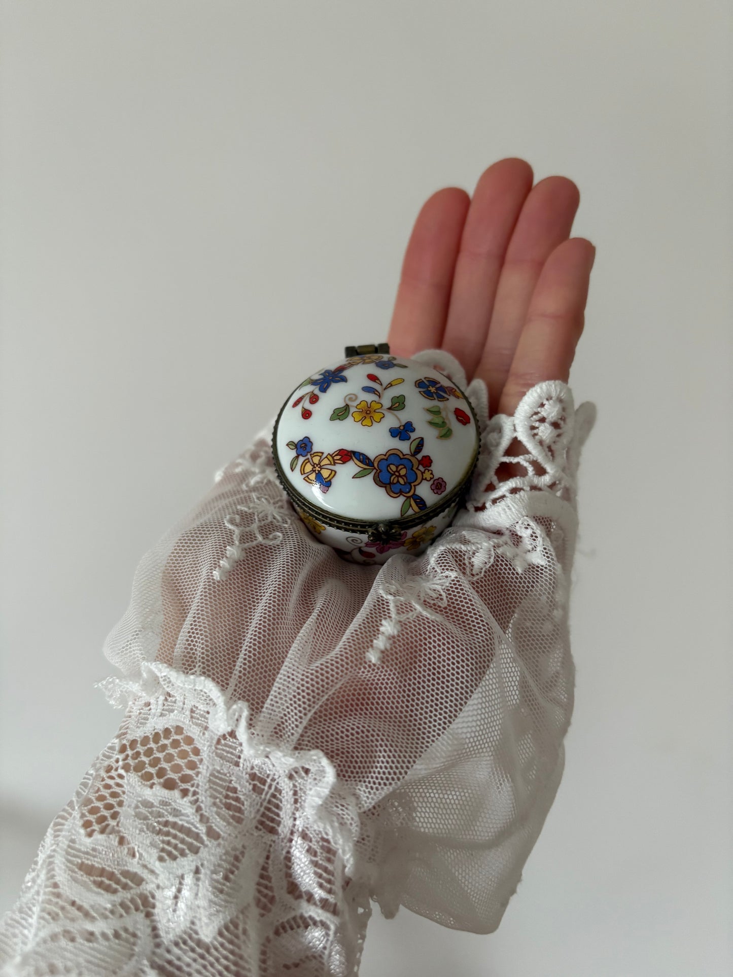 Round porcelain casket with colorful flowers