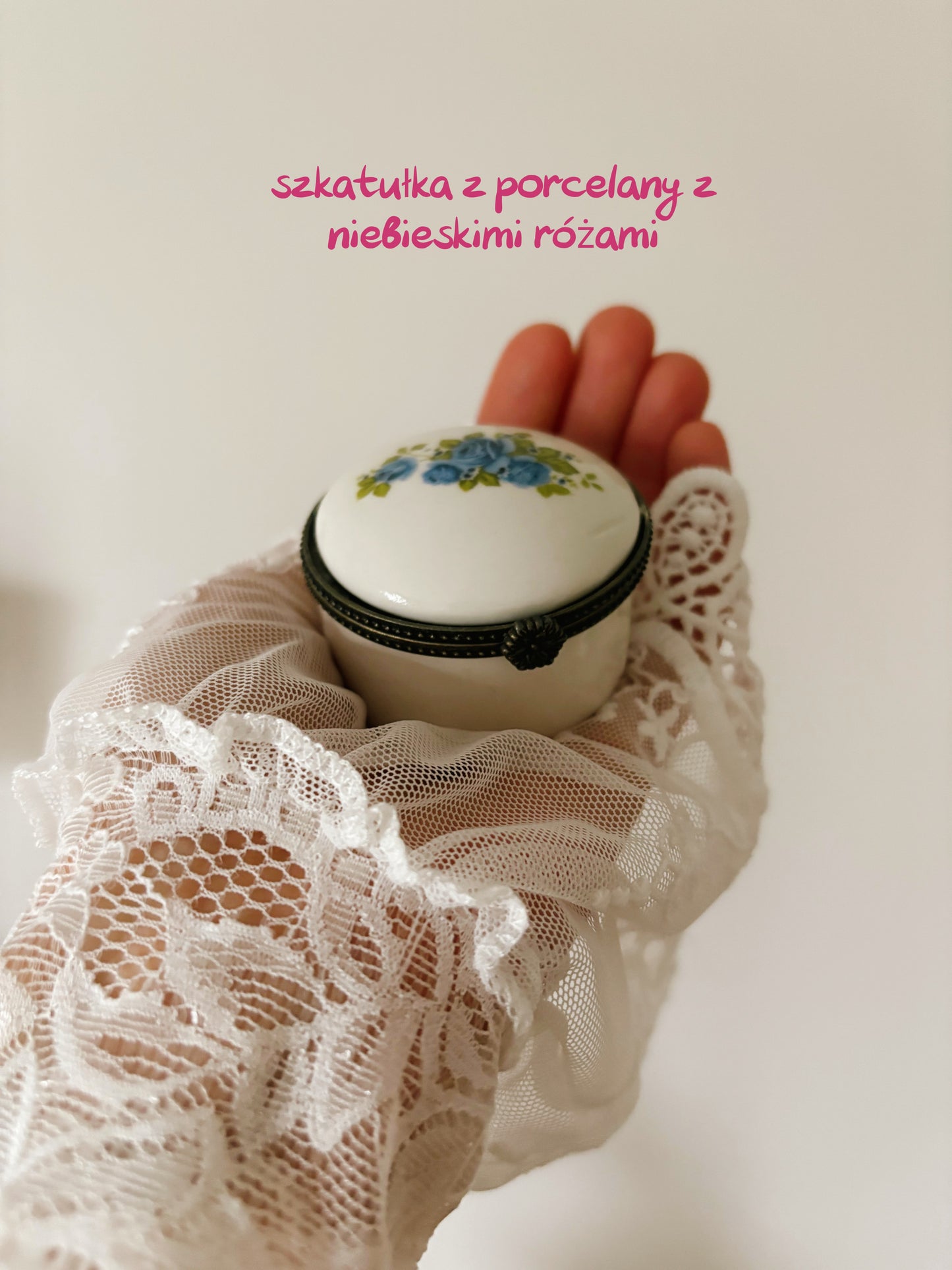 Round porcelain trinket box with blue roses